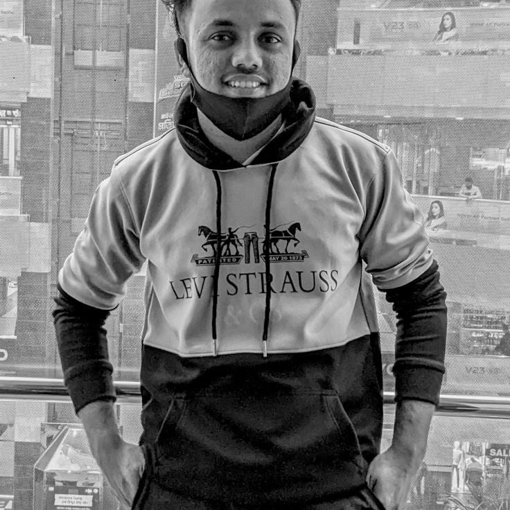 Ava Marshall, Lead Design Curator at Adaptive Know Ledgebase, reviewing corporate floral arrangements